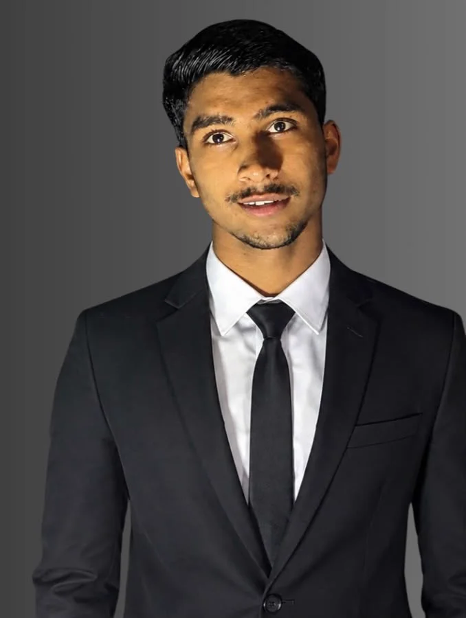 Muhammad Ali Haider in a professional black suit